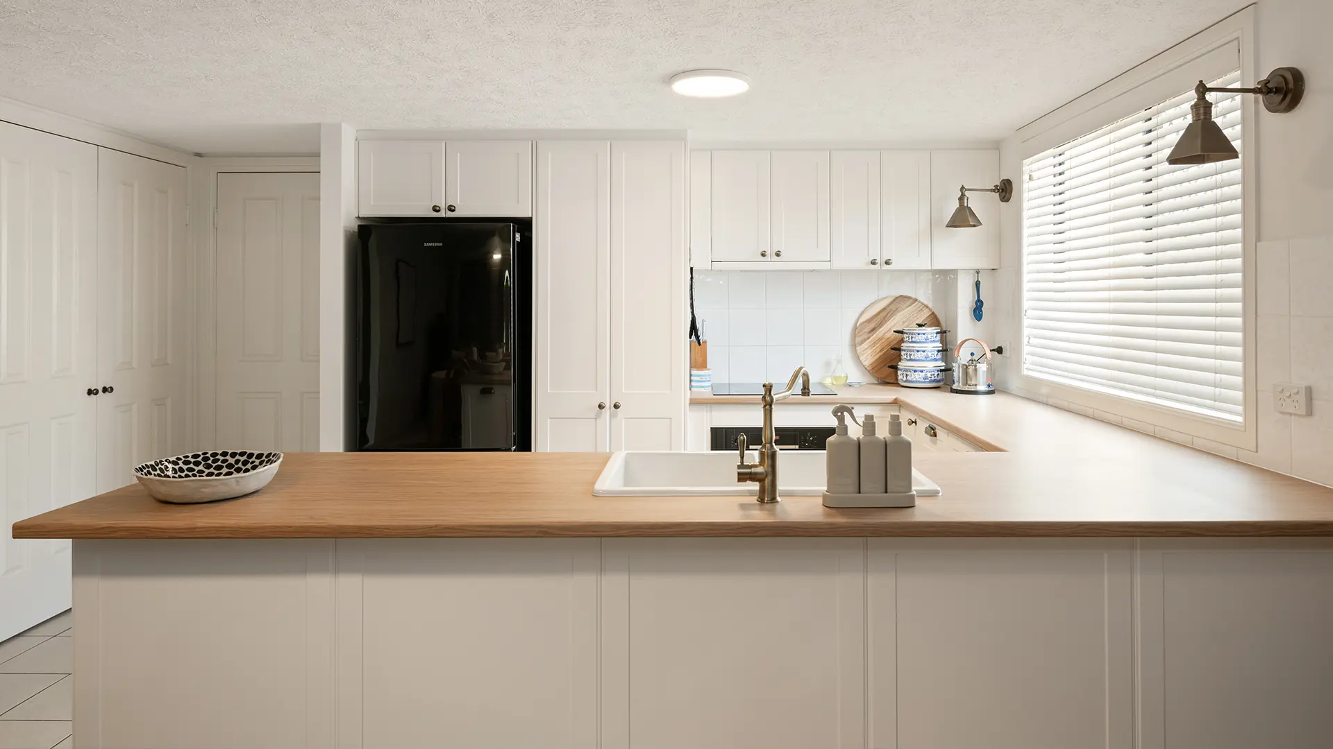 Beautiful kitchen renovation with wood grain benchtop
